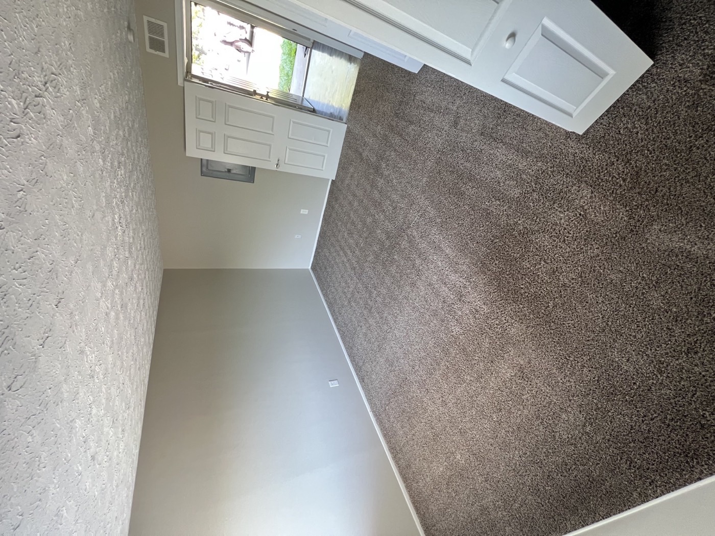 A rental living room with freshly cleaned carpet